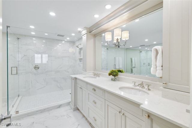 full bath featuring recessed lighting, marble finish floor, a sink, and a marble finish shower