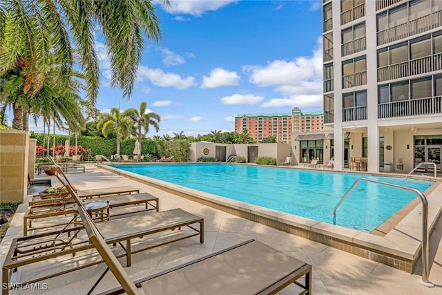 community pool with a patio area