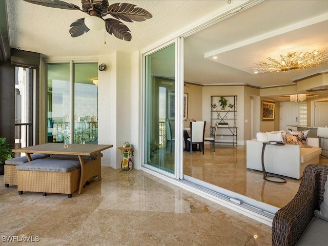 balcony with ceiling fan and a patio