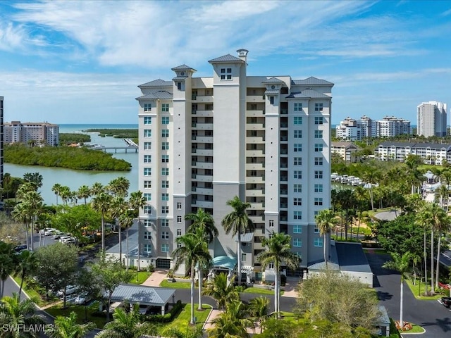 view of property featuring a view of city and a water view