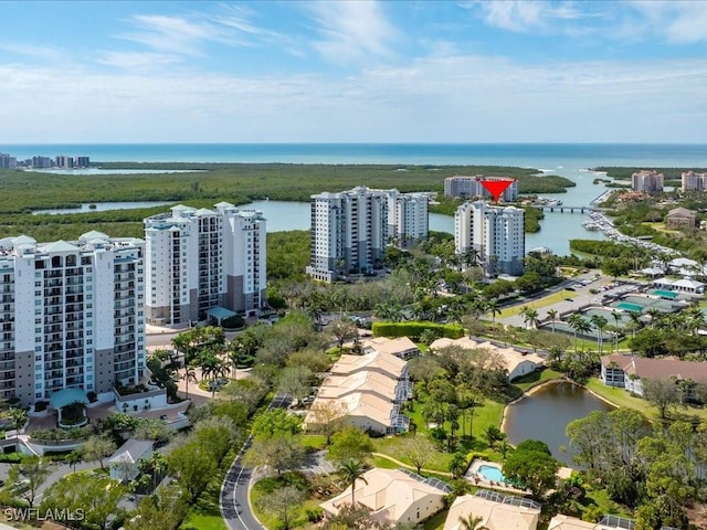 birds eye view of property featuring a view of city and a water view