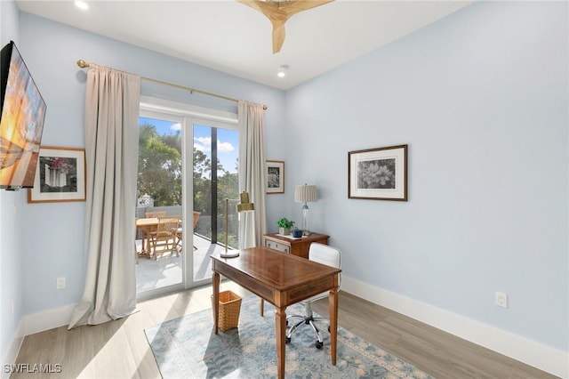 home office with light wood-style floors, recessed lighting, and baseboards