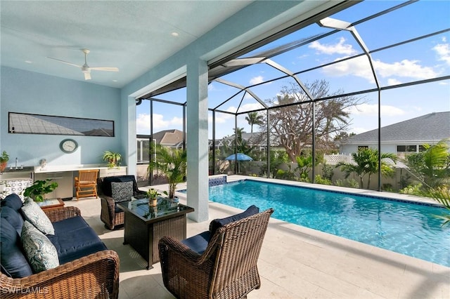 outdoor pool featuring ceiling fan, a patio, outdoor lounge area, and a lanai