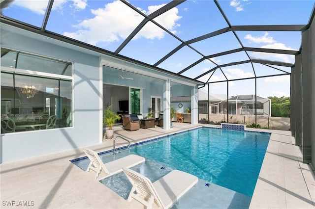 outdoor pool with a lanai and a patio