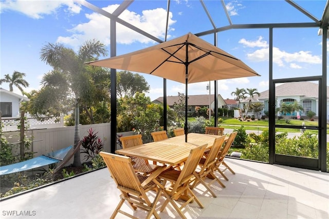 view of patio / terrace featuring glass enclosure