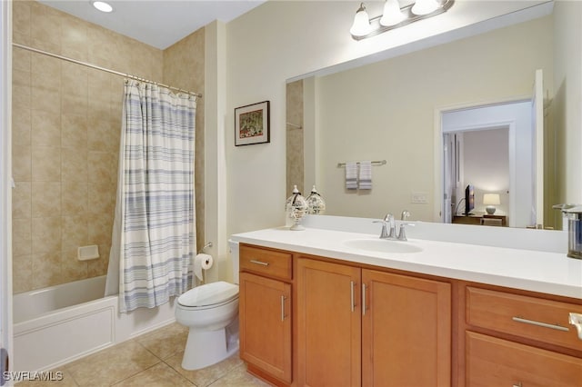 full bath featuring vanity, tile patterned floors, toilet, and shower / bath combo with shower curtain