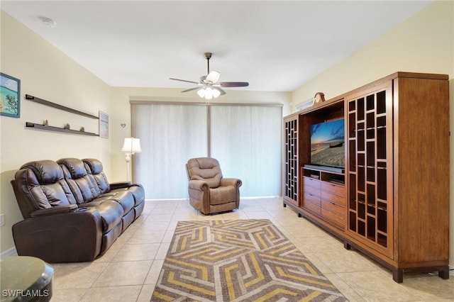 living room with tile patterned floors and a ceiling fan