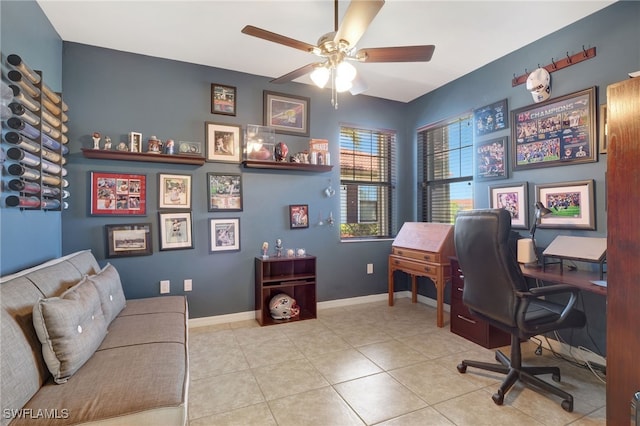 home office featuring tile patterned flooring, a ceiling fan, and baseboards