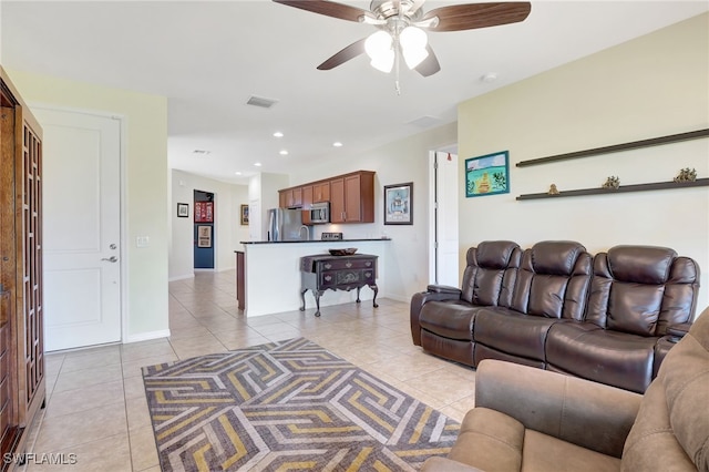 living room featuring light tile patterned floors, baseboards, visible vents, recessed lighting, and ceiling fan