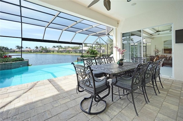 outdoor pool with a lanai, an outdoor hangout area, a water view, a ceiling fan, and a patio area