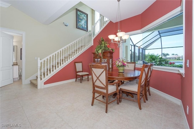 dining area featuring stairway, plenty of natural light, and baseboards