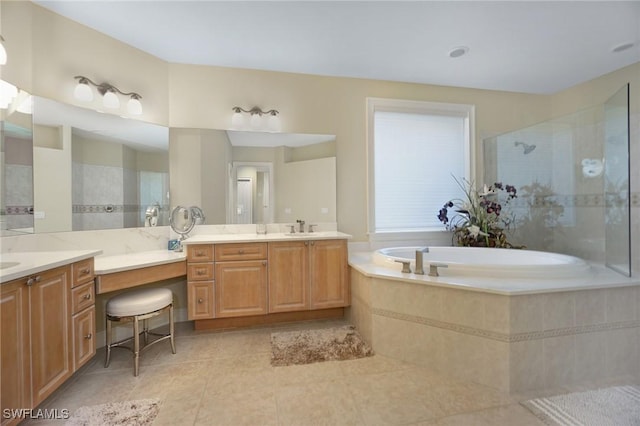 full bath featuring a tile shower, vanity, a bath, and tile patterned floors