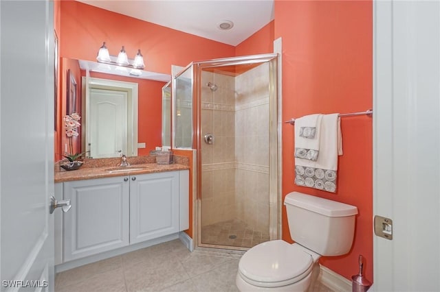 full bathroom with toilet, a stall shower, tile patterned flooring, and vanity