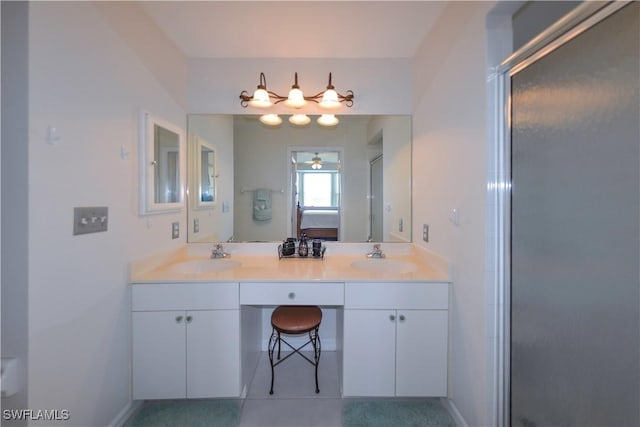 full bathroom with connected bathroom, a sink, and double vanity