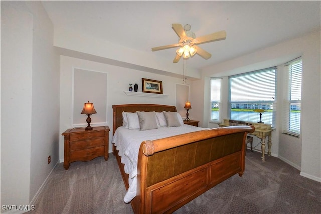 bedroom with carpet flooring, a ceiling fan, and baseboards