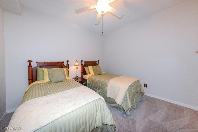 carpeted bedroom with lofted ceiling, a ceiling fan, and baseboards