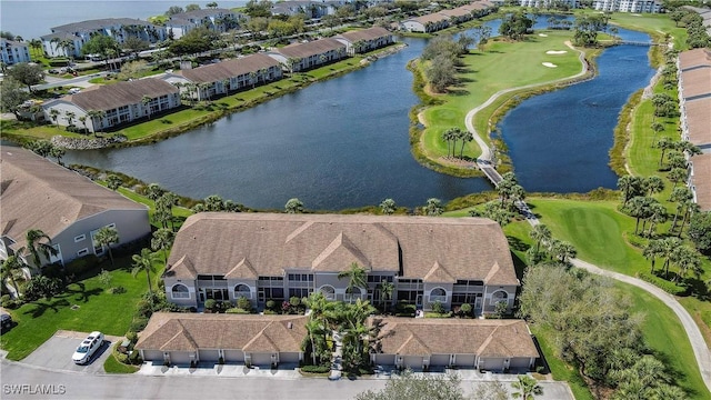 birds eye view of property featuring a residential view and a water view