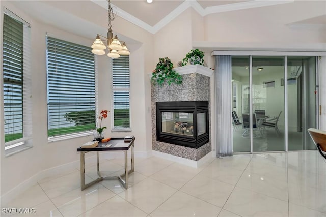 corridor with a chandelier, tile patterned flooring, crown molding, and baseboards