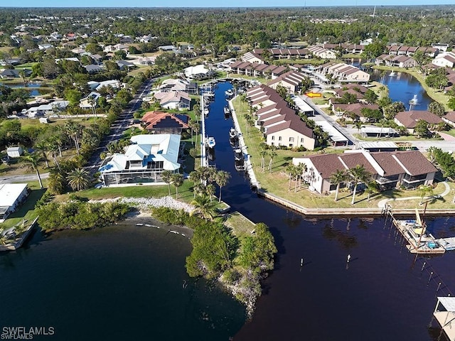 drone / aerial view featuring a residential view and a water view