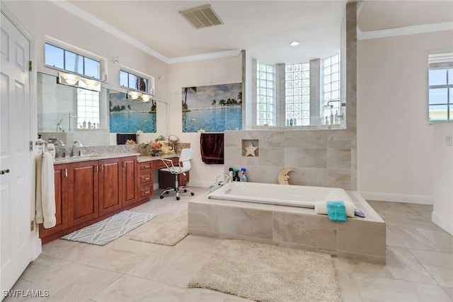 full bathroom featuring vanity, ornamental molding, a garden tub, and visible vents