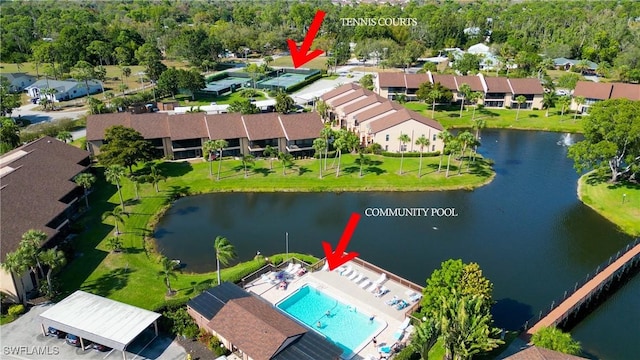 birds eye view of property with a water view and a residential view