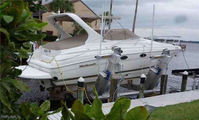 view of dock with a water view and boat lift