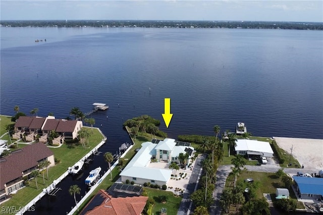 bird's eye view featuring a water view and a residential view