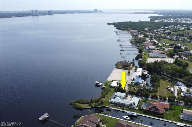 birds eye view of property featuring a water view