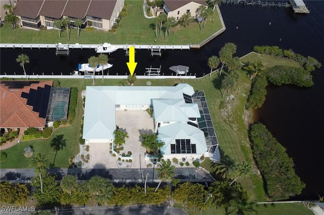 birds eye view of property with a water view