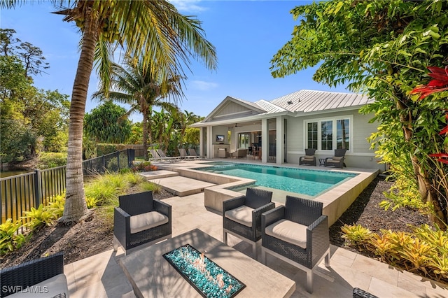 view of pool with a fenced in pool, a patio area, fence, and ceiling fan