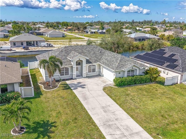 aerial view with a water view and a residential view