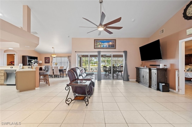 living room with a ceiling fan, visible vents, high vaulted ceiling, and light tile patterned floors