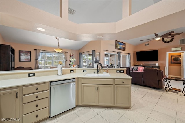 kitchen with a sink, cream cabinetry, light countertops, and dishwasher