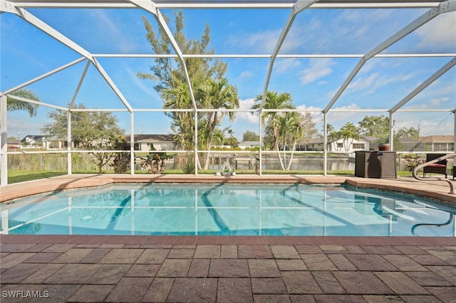 outdoor pool with a lanai, a residential view, and a patio