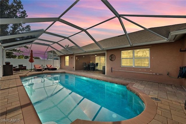 view of swimming pool featuring a patio area, a lanai, and a fenced in pool