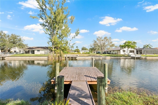 view of dock featuring a water view and a residential view