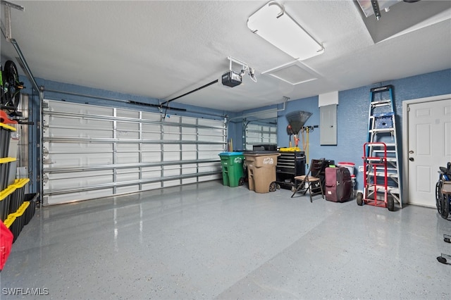 garage featuring electric panel and a garage door opener