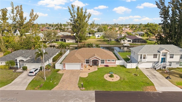 aerial view with a water view and a residential view