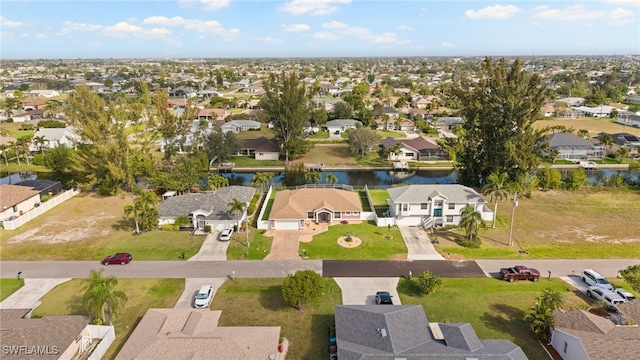 aerial view featuring a water view and a residential view