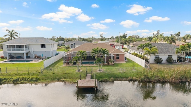 exterior space with a residential view and a water view