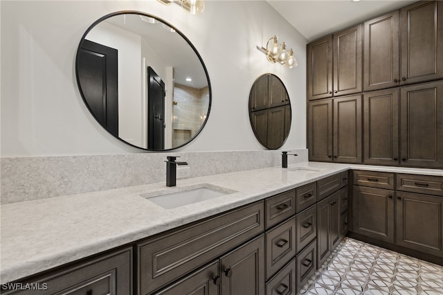 full bath featuring a sink and double vanity