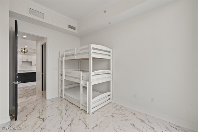 unfurnished bedroom featuring marble finish floor, visible vents, and baseboards