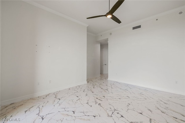 empty room with a ceiling fan, visible vents, baseboards, marble finish floor, and ornamental molding