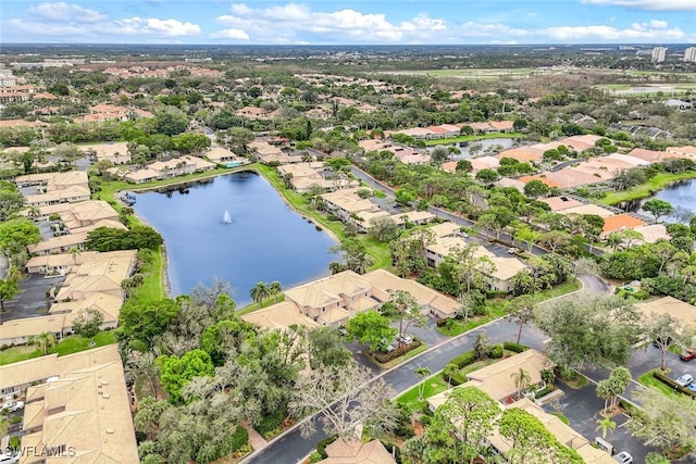 birds eye view of property featuring a water view and a residential view