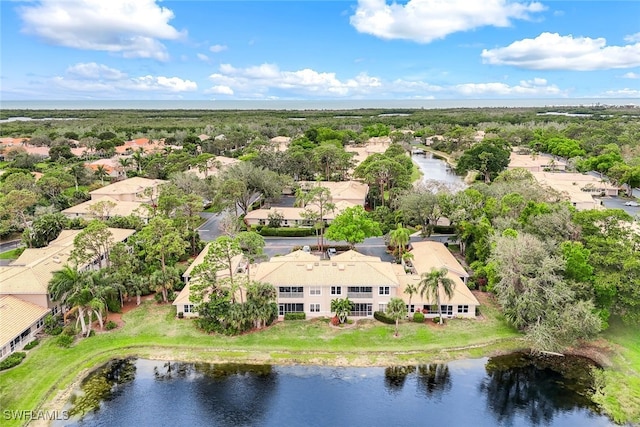 bird's eye view featuring a water view and a residential view