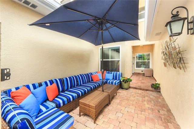 view of patio featuring visible vents and an outdoor living space