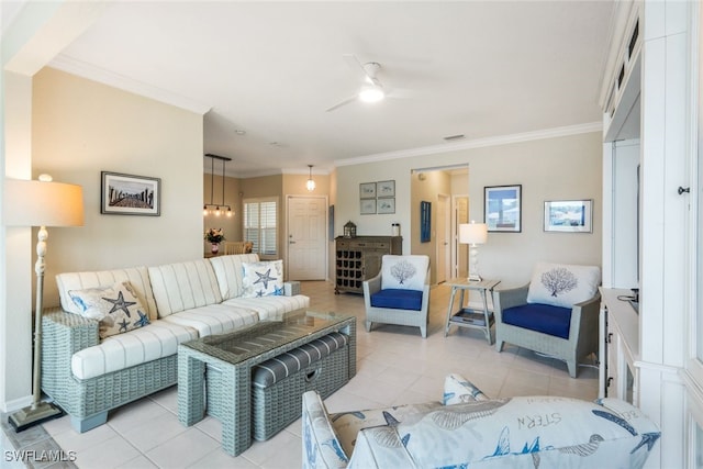 living room with light tile patterned floors and crown molding