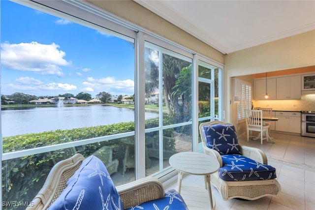 sunroom / solarium with a water view