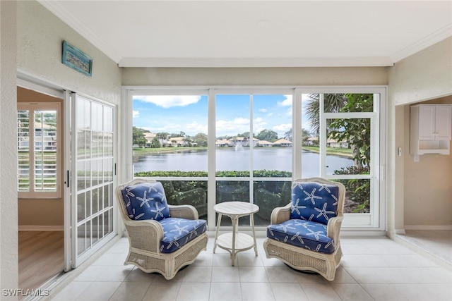 sunroom / solarium with a water view