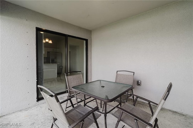 view of patio featuring outdoor dining area